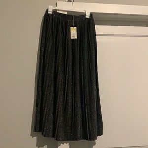 Long pleated black shimmer skirt